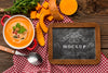 Top View Of Bowl Of Vegetable Soup With Chalkboard Psd