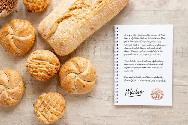 Top View Of Bread With Notebook Psd