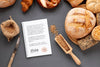 Top View Of Bread With Wheat And Notebook Psd