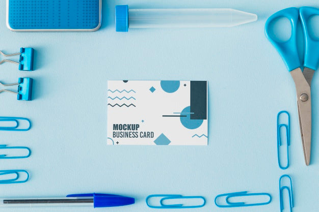 Top View Of Business Card Mock-Up With Office Essentials Psd