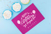 Top View Of Card With Happy Birthday And Cupcakes Psd