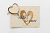Top View Of Card With Heart-Shaped Golden Pin Psd