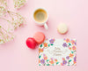 Top View Of Card With Macarons And Coffee Cup Psd