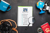 Top View Of Checklist With Magnifying Glass And Camera For Traveling Psd