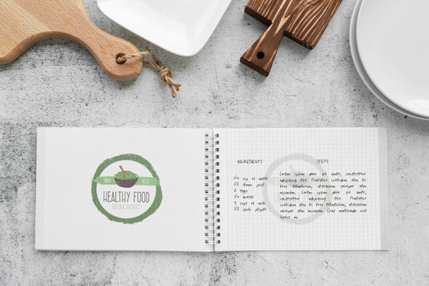 Top View Of Chopping Board With Notebook Psd