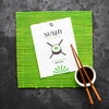 Top View Of Chopsticks With Soy Sauce On Bamboo Roller For Sushi Psd
