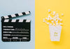 Top View Of Cinema Clapperboard With Popcorn And Clapperboard Psd