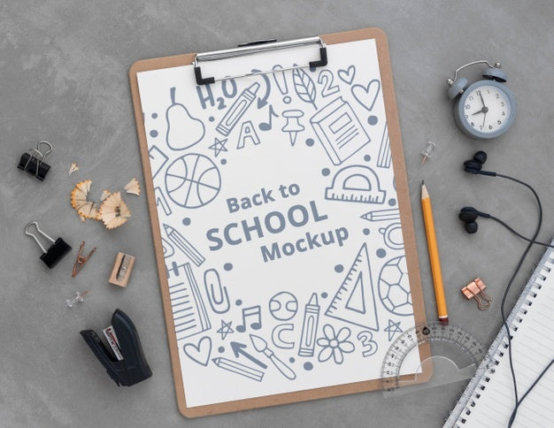 Top View Of Clip Pad With School Supplies Psd
