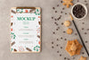 Top View Of Clipboard With Snowflake Cookies And Chocolate Chips Psd