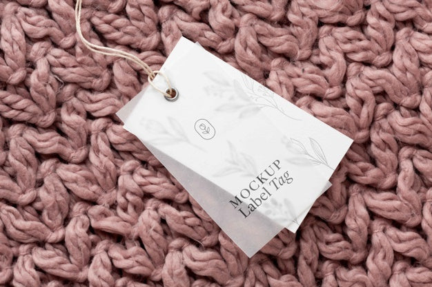 Top View Of Clothing Label Mock-Up On Knitted Fabric Psd