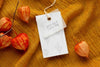 Top View Of Clothing Label Mock-Up On Orange Textile Psd