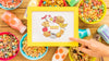 Top View Of Colorful Cereals And Frame On Wooden Table Psd