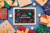 Top View Of Colorful Gifts And Chalkboard Psd
