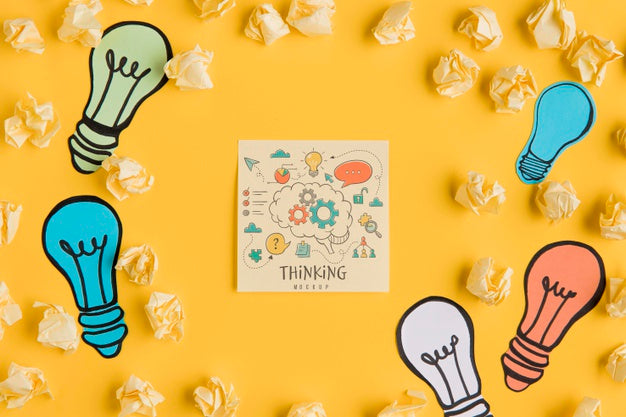 Top View Of Crinkled Paper With Light Bulbs Psd