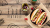 Top View Of Delicious Hot Dogs On Wooden Table Psd
