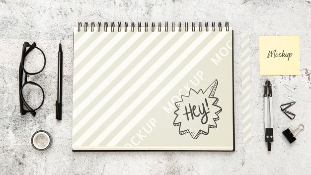 Top View Of Desk Surface With Glasses And Notebook Psd