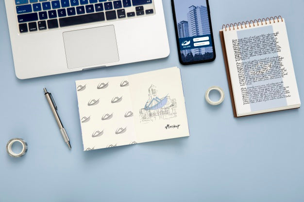 Top View Of Desk Surface With Laptop And Notebook Psd