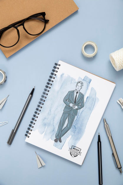 Top View Of Desk Surface With Notebook And Glasses Psd