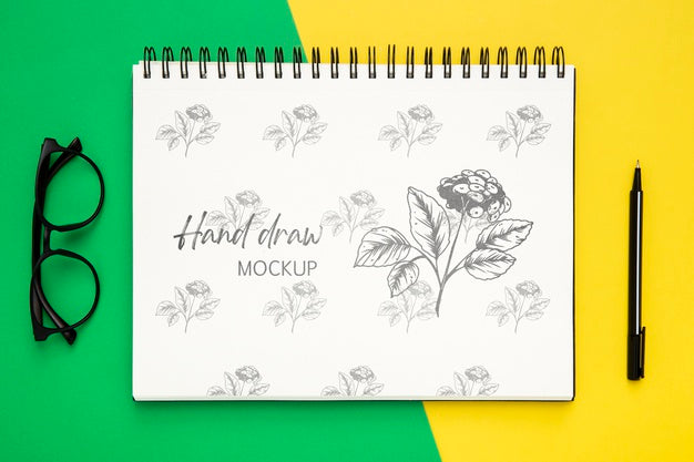 Top View Of Desk Surface With Notebook And Glasses Psd