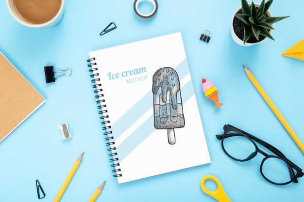 Top View Of Desk Surface With Notebook And Glasses Psd