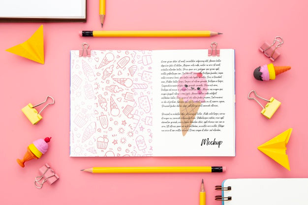 Top View Of Desk Surface With Notebook And Paper Clips Psd