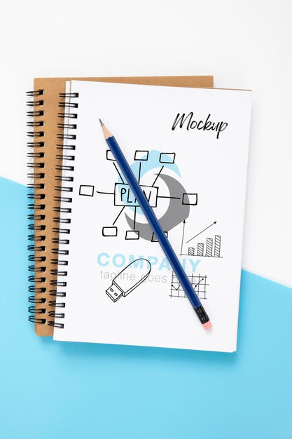 Top View Of Desk Surface With Notebook And Pen Psd