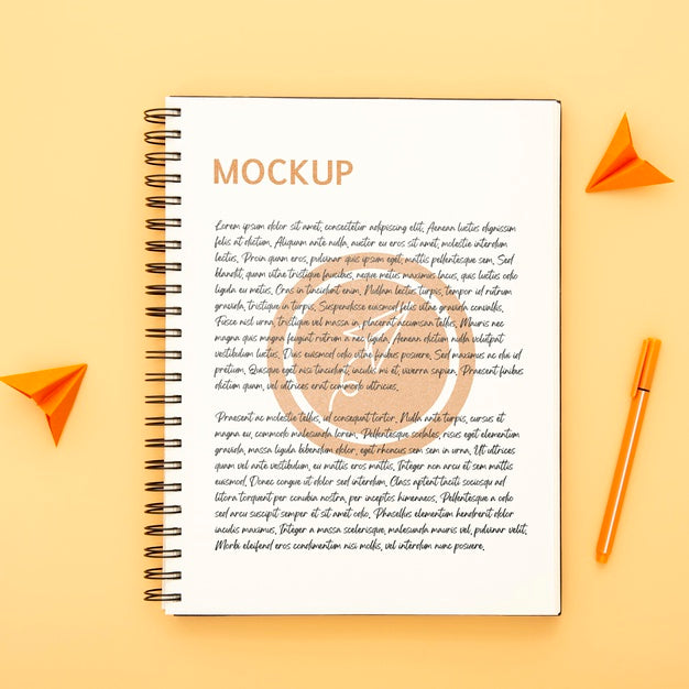 Top View Of Desk Surface With Notebook And Pen Psd