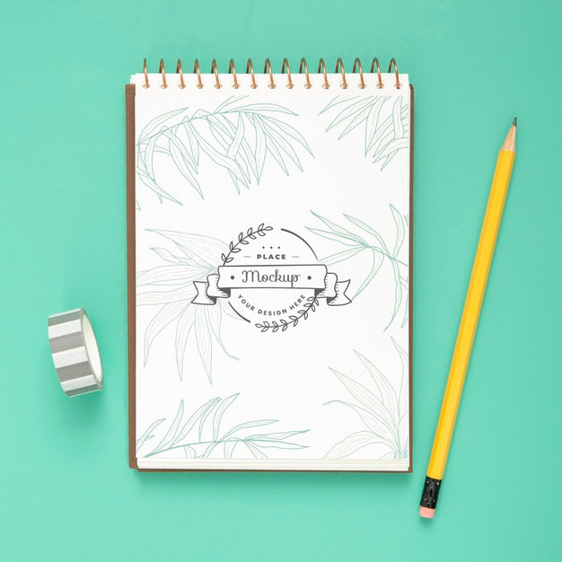 Top View Of Desk Surface With Notebook And Pencil Psd