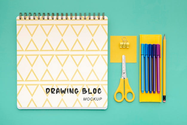 Top View Of Desk Surface With Notebook And Scissors Psd