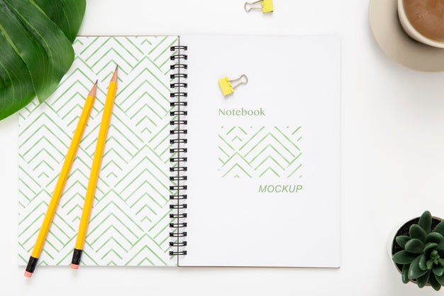 Top View Of Desk Surface With Notebook And Succulent Psd