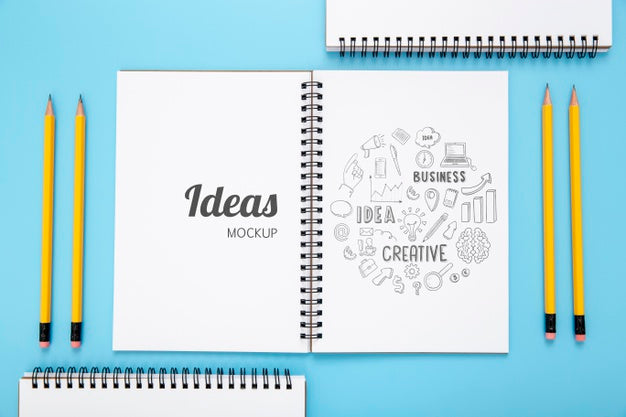 Top View Of Desk Surface With Notebooks And Pencils Psd