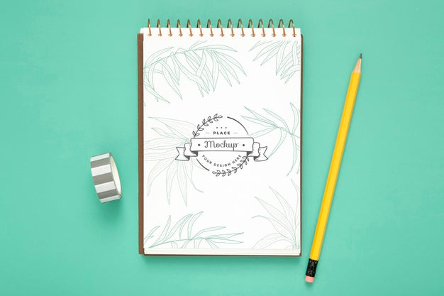 Top View Of Desk Surface With Pencil And Notebook Psd