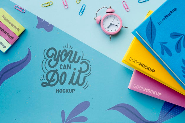 Top View Of Desk With Clock And Notebooks Psd