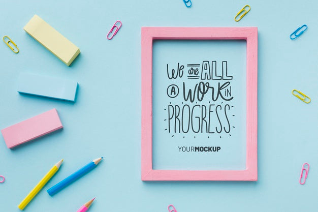 Top View Of Desk With Frame And Erasers Psd