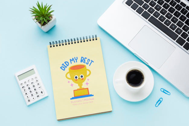 Top View Of Desk With Laptop And Notebook Psd