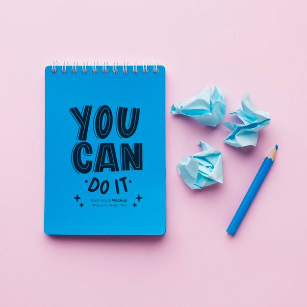 Top View Of Desk With Notebook And Crinkled Paper Psd