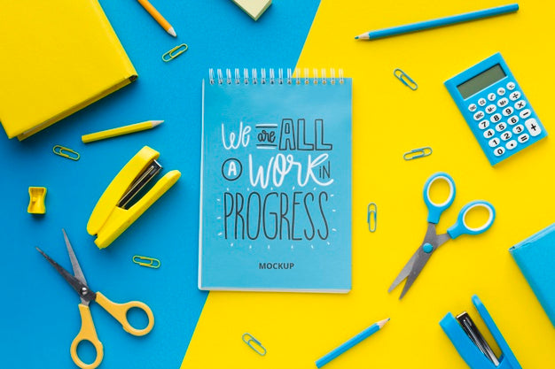 Top View Of Desk With Notebook And Scissors Psd