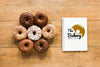 Top View Of Donuts With Notebook Psd