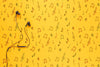 Top View Of Earphones On Yellow Background With Copy Space Psd