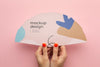 Top View Of Female Hands Holding Mock-Up Paper Fan Psd