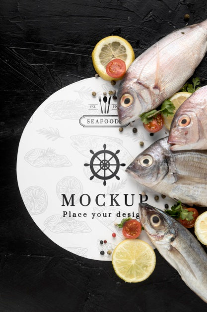Top View Of Fish With Lemon And Tomatoes Psd