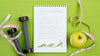 Top View Of Fitness Notebook With Apple And Measuring Tape Psd