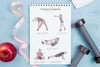 Top View Of Fitness Notebook With Apple And Weights Psd