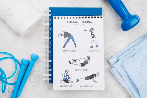 Top View Of Fitness Notebook With Jumping Rope And Towels Psd