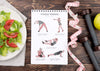 Top View Of Fitness Notebook With Measuring Tape And Weights Psd