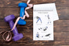 Top View Of Fitness Notebook With Measuring Tape And Weights Psd