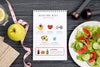 Top View Of Fitness Notebook With Plate Of Salad Psd