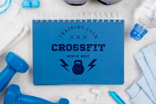 Top View Of Fitness Notebook With Weights And Jumping Rope Psd