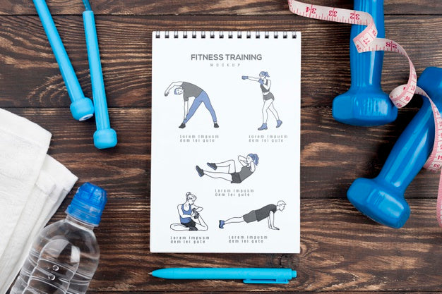Top View Of Fitness Notebook With Weights And Water Bottle Psd