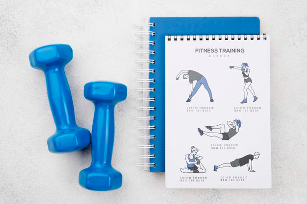 Top View Of Fitness Notebook With Weights Psd